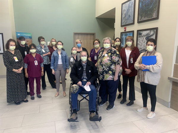 Wayne Martin, seated, and his wife Cherelee, right of Wayne, get a warm farewell from staff at The Rehabilitation Hospital of Montana after spending a week in intensive therapy to recover from injuries from an unfortunate encounter with a cow.
