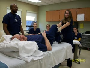  Kristina Pekovic, at the end of the bed, is a recent PTA Clinical Affiliation student who completed her in-service on joint mobility with RehabCare at Kindred Hospital – Indianapolis. Also pictured are Jeff Paris (Kristina’s supervisor on the mat), Duane Alexander (rehab tech), Corey Rheinhardt (rehab tech), Tracy Rutherford (OTR) and Lauren Meyer (PTA student).